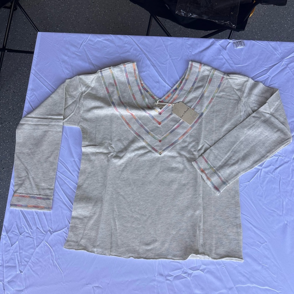 Hem and thread long sleeve